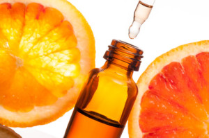 Essential oil with orange_Olio essenziale con fetta di arancio
